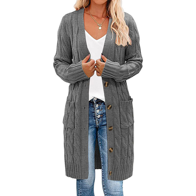 Damkofta med lång ärm, knäppning och fickor