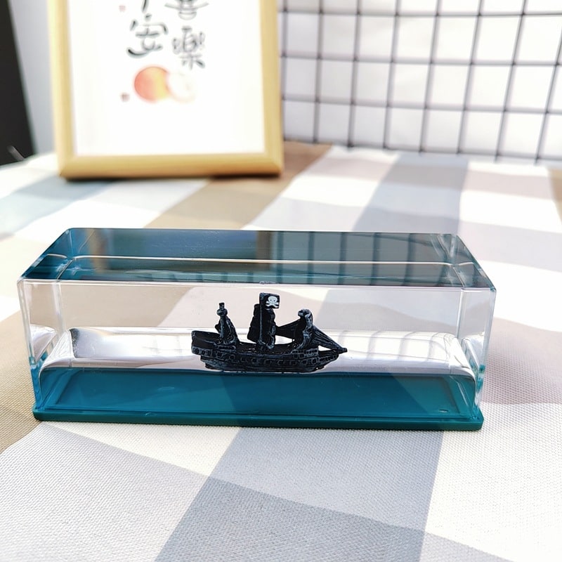 Liquid Wave Paperweight with LED Light Base and Floating Ship - Image 10