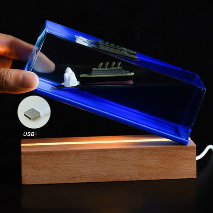 Liquid Wave Paperweight with LED Light Base and Floating Ship - Image 6