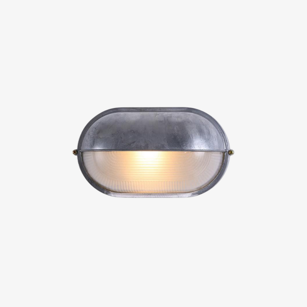 Outdoor Wall Light with Bulkhead Design Oval Eyelid Cover and Industrial Nautical Style - Image 1