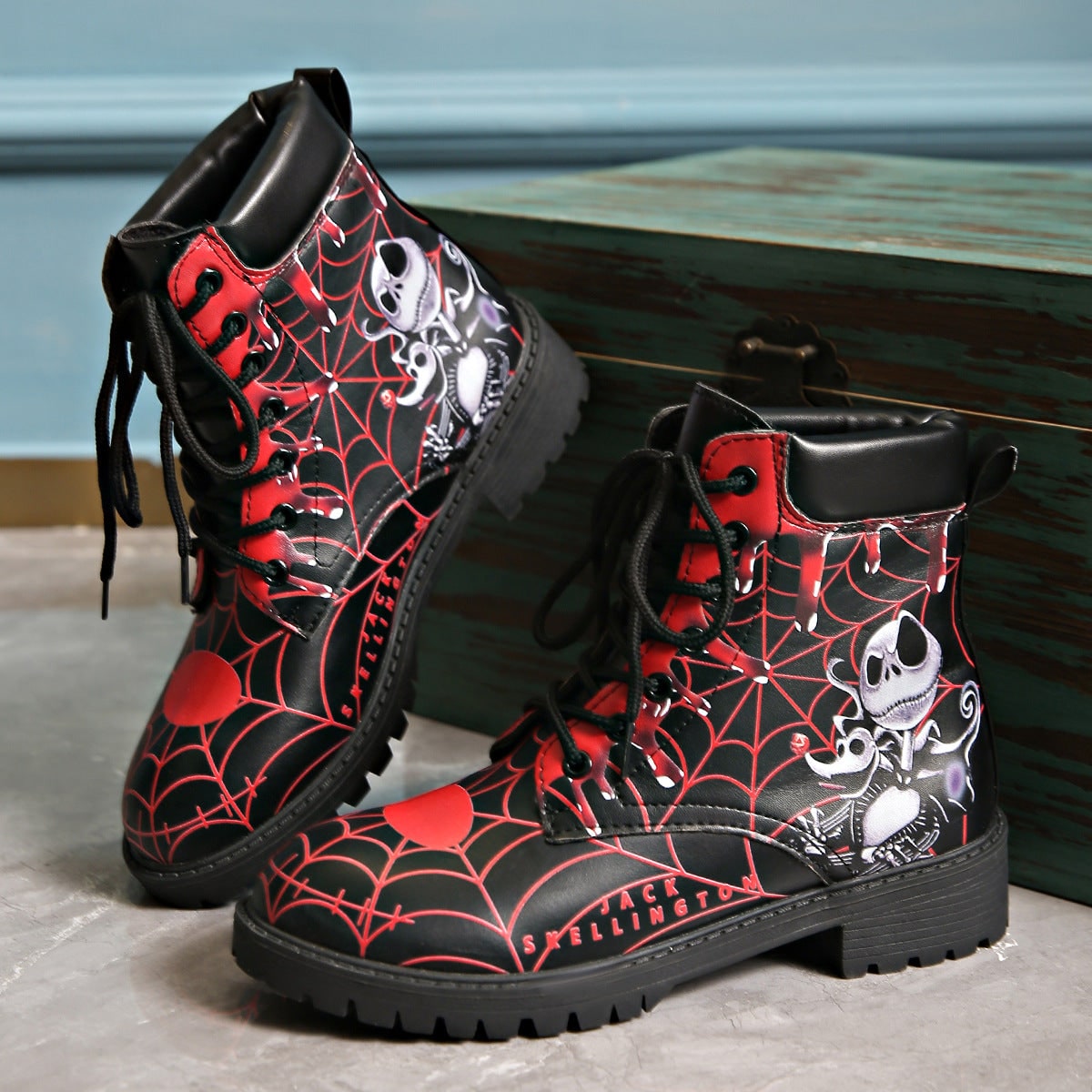 Women's Halloween Lace Up Combat Boots with Black Skeleton Spiderweb Print and Padded Ankle Collar - Image 1